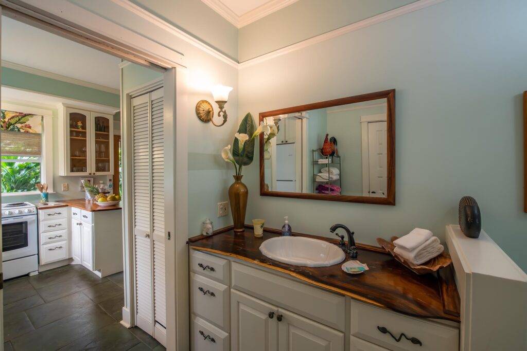 Cottage bathroom with view of kitchen