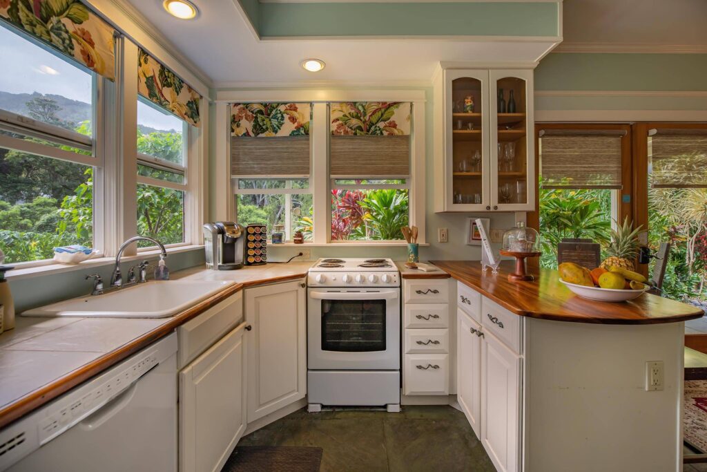 Cottage kitchen counters sink and stove looking towards back of valley