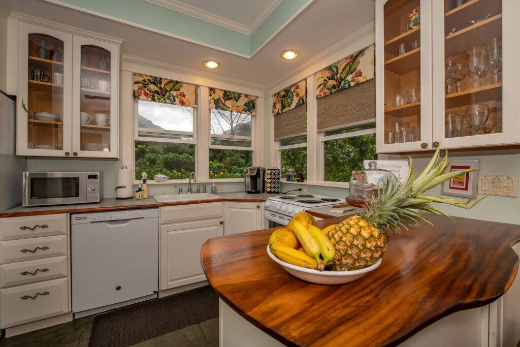 Cottage kitchen with microwave tropical garden view and bar with fruit