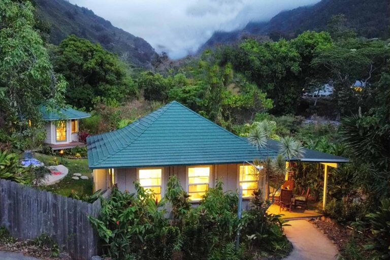 Cottage from above and lit up in the evening