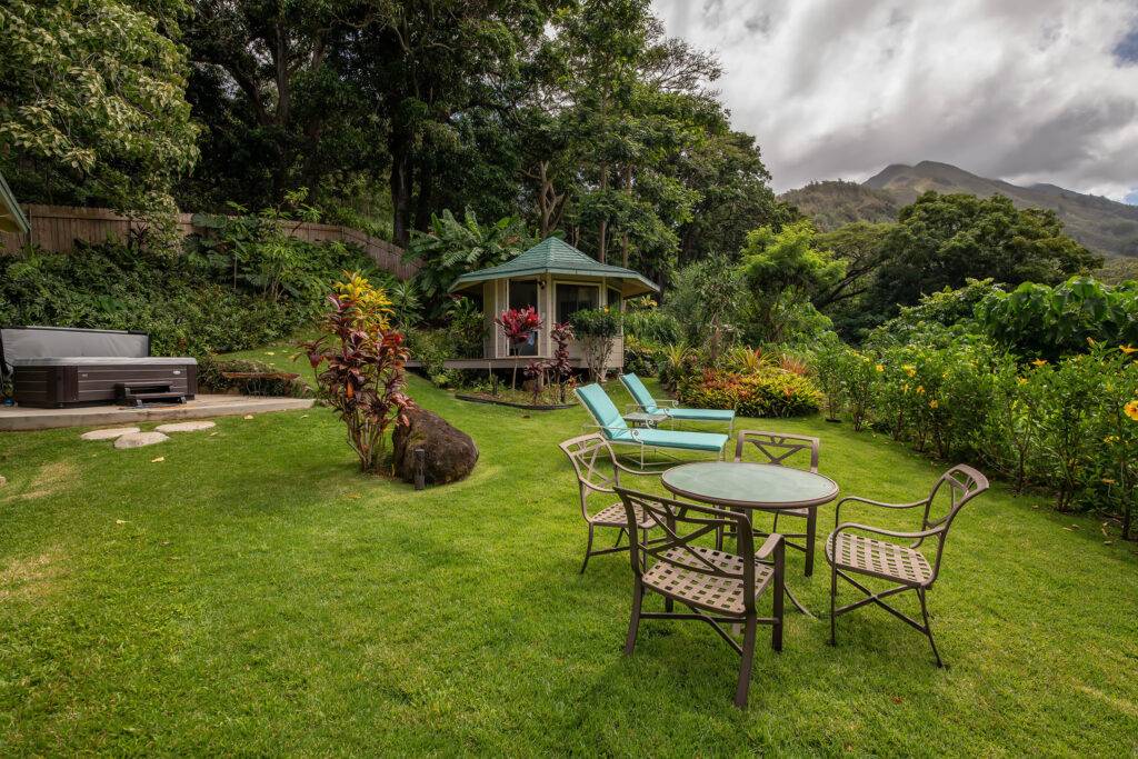 Cottage yard with hot tub gazebo and outdoor dining and relaxation