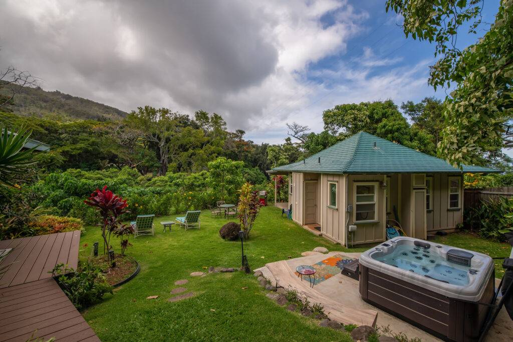 View towards river of hot tub and cottage