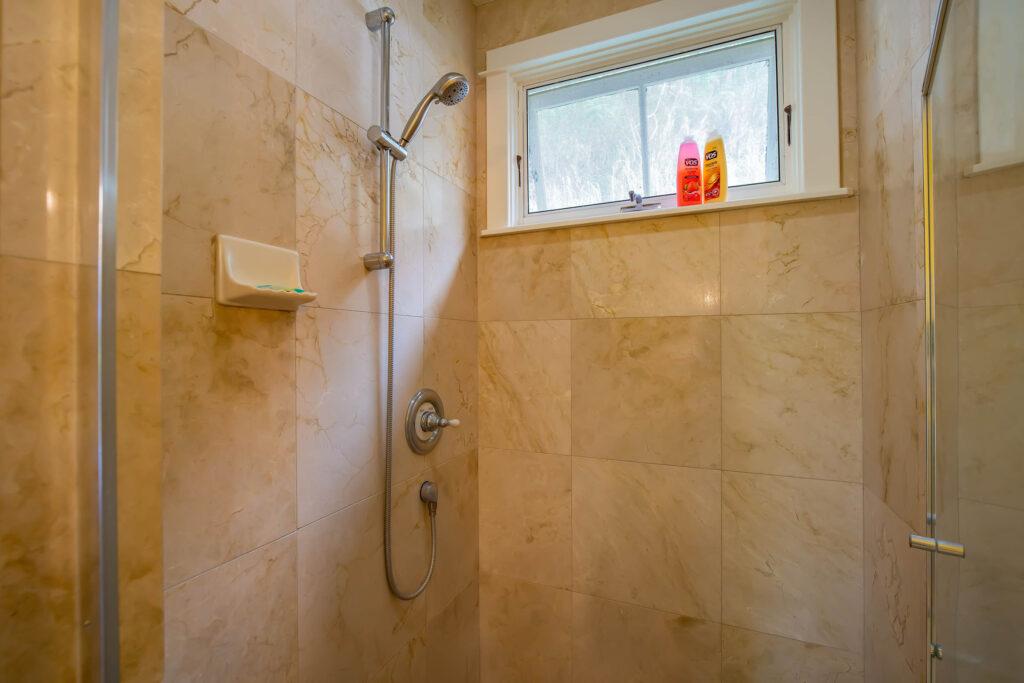 Palms room rental tiled shower